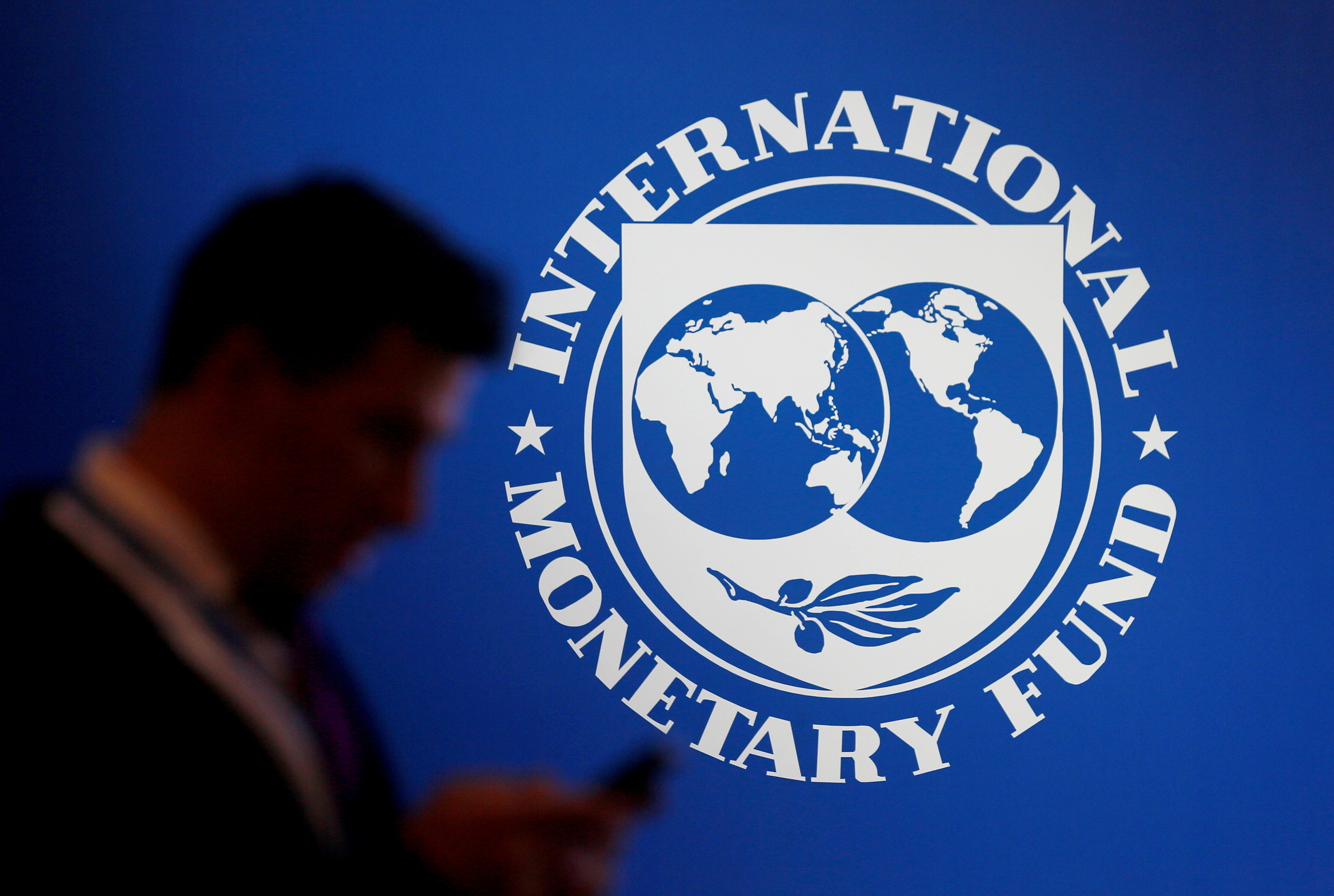 The International Monetary Fund (IMF) logo at a meeting in 2018. 